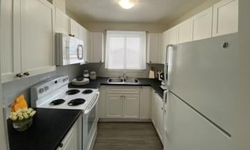 Kitchen view of 3 bedroom townhome at River Park Glen