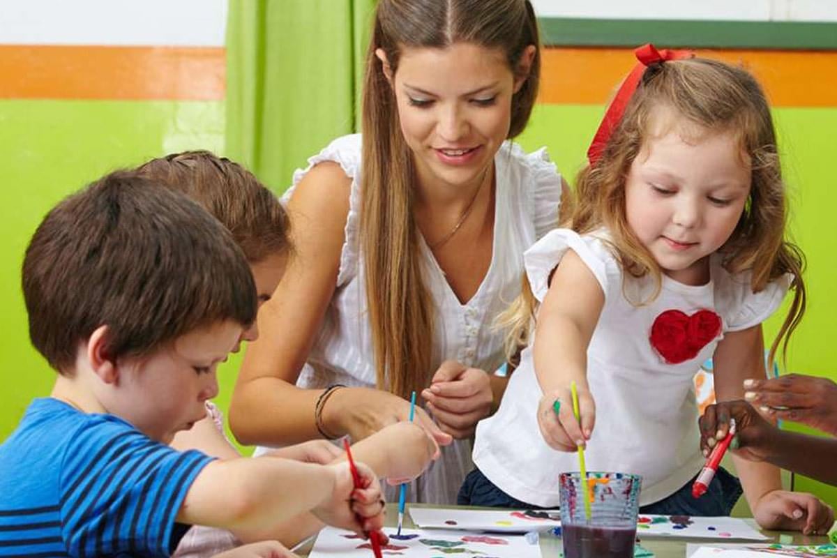 Children painting at daycare 